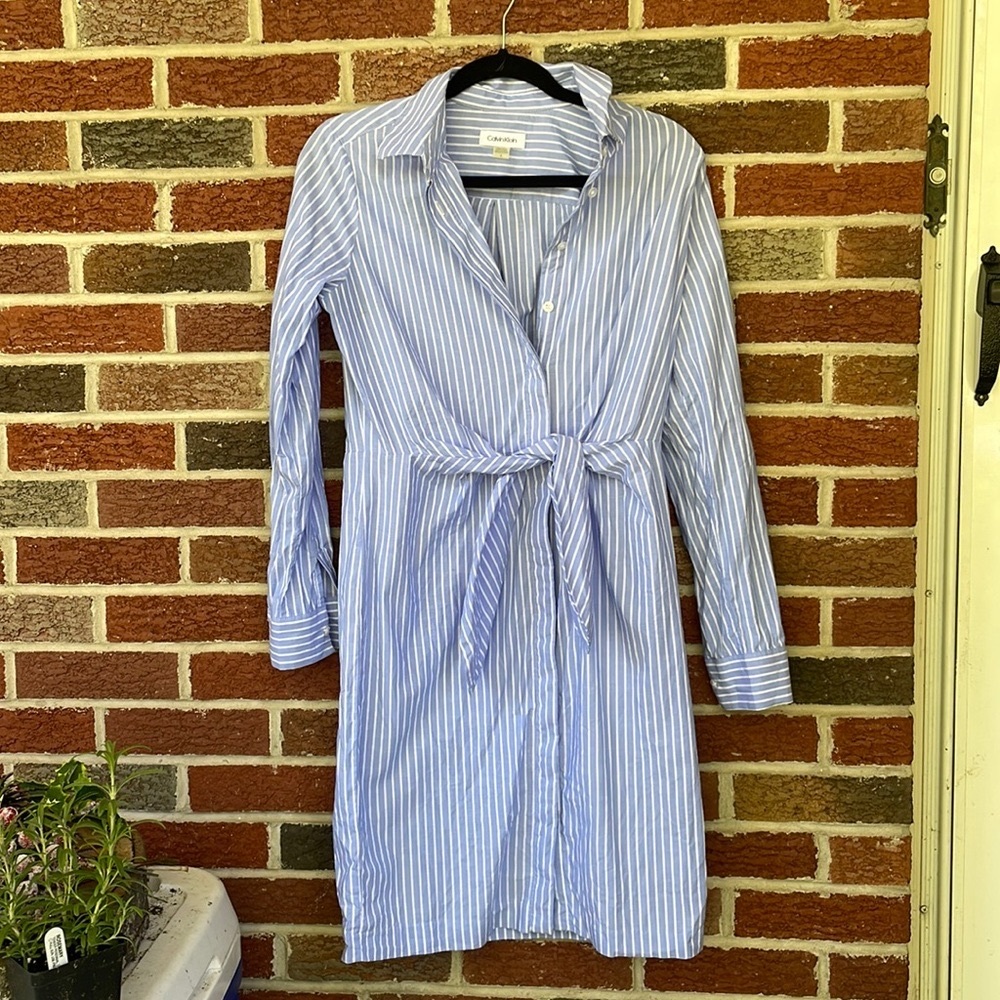 Calvin Klein button down dress with tie in front. Size is a 04.